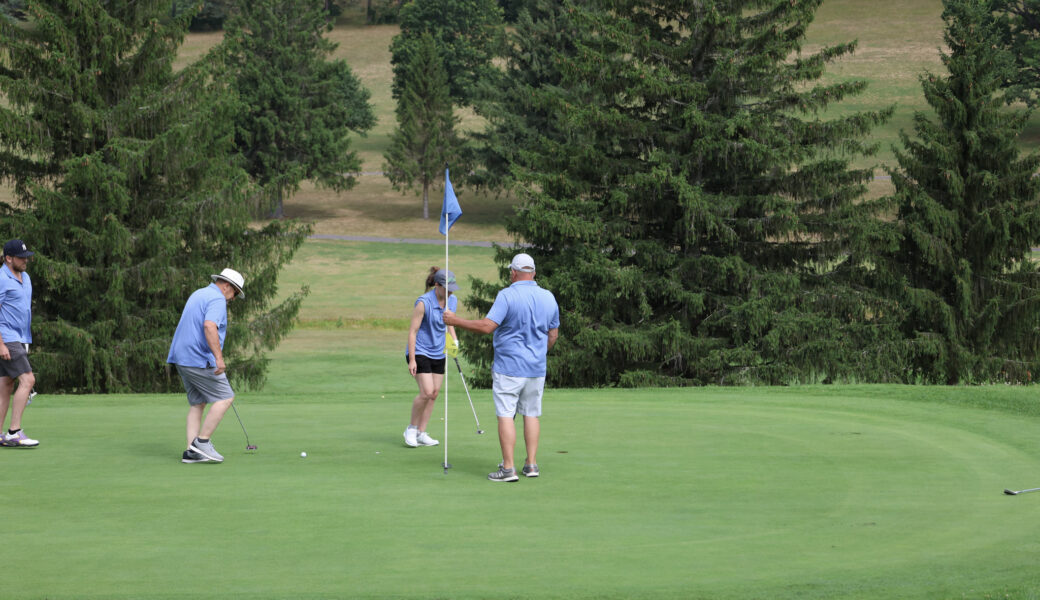 Golf team on green at event