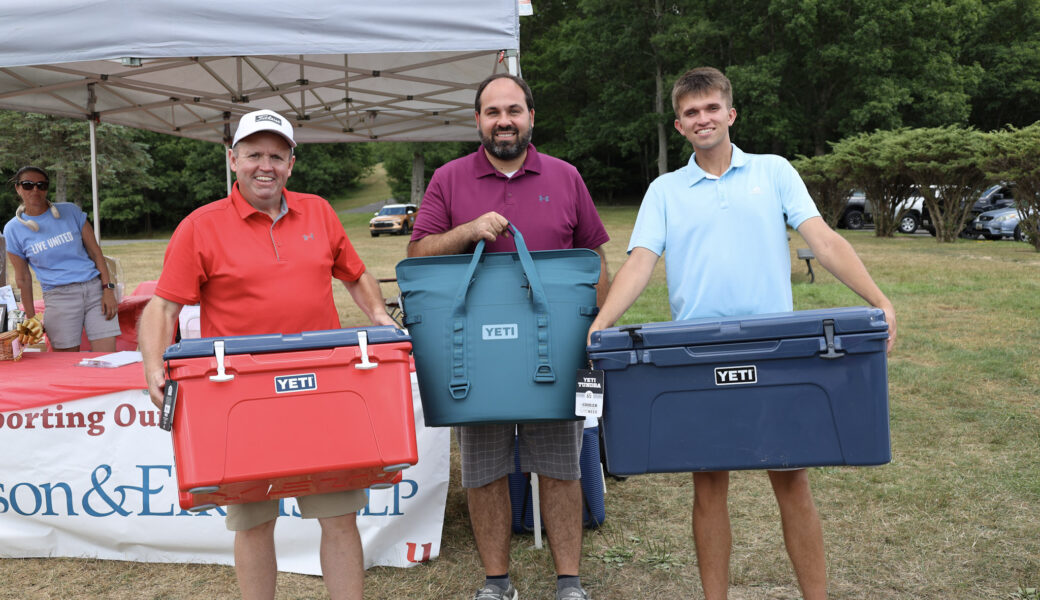 Three Yeti prize winners from golf event.