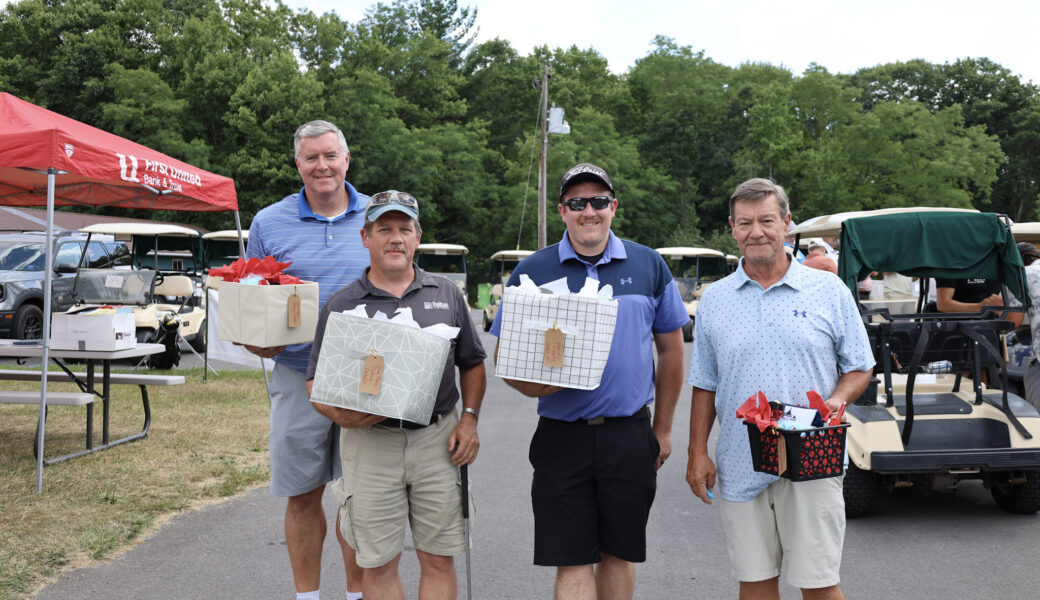 Four prize winners from golf event.