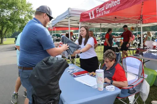 A golfer checks in at registration.