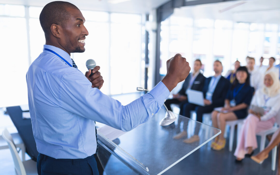 A man confidently gives a presentation at work.