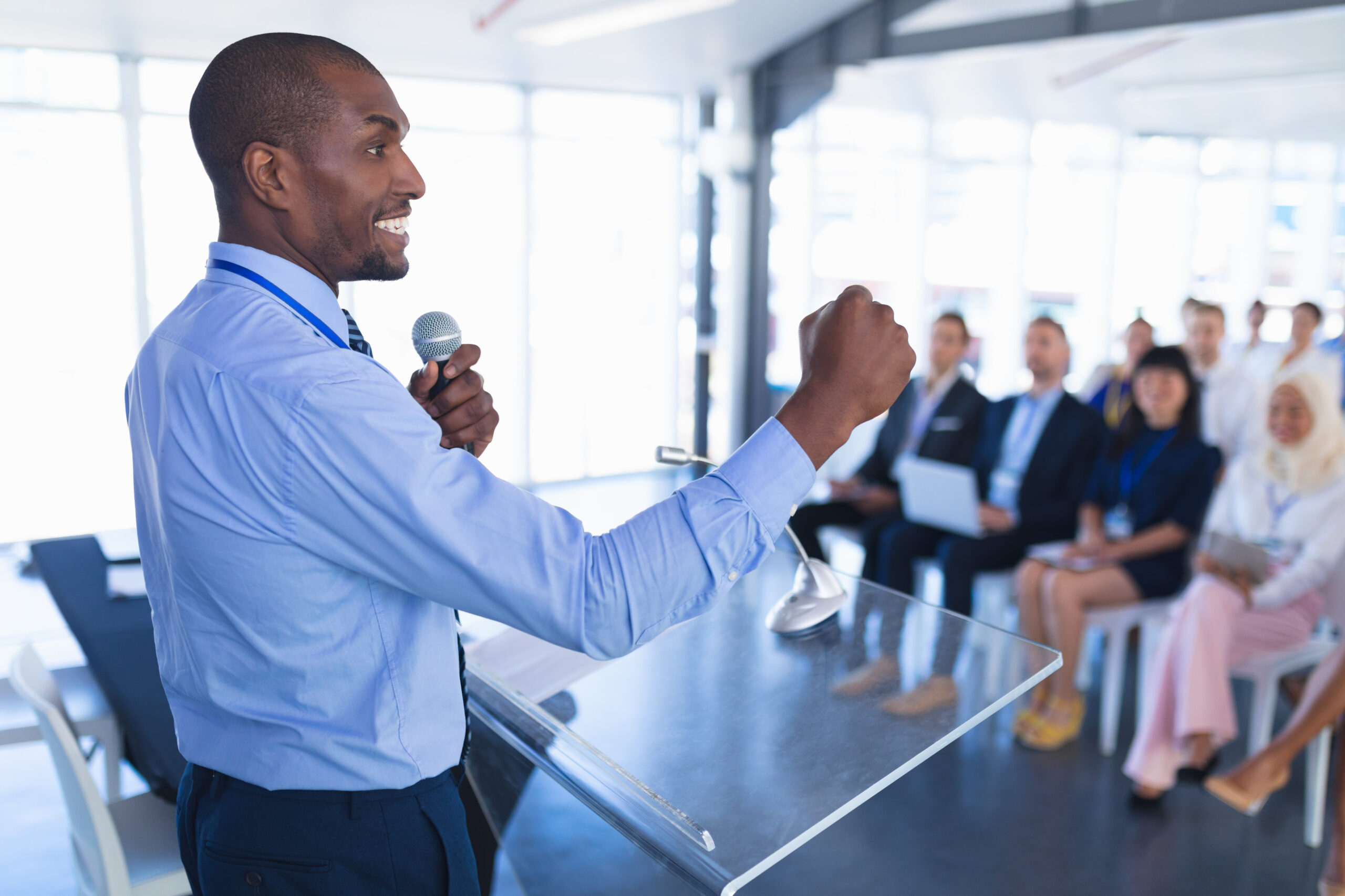 A man confidently gives a presentation at work.