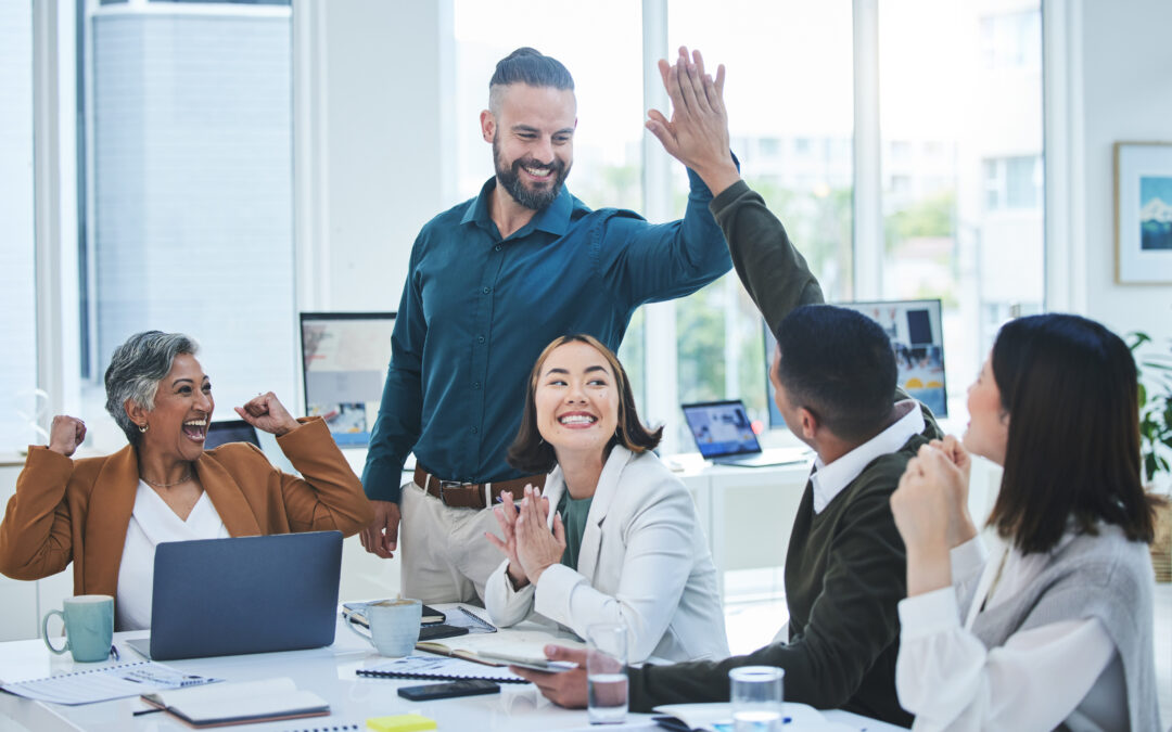 A group of happy employees working in a healthy environment.