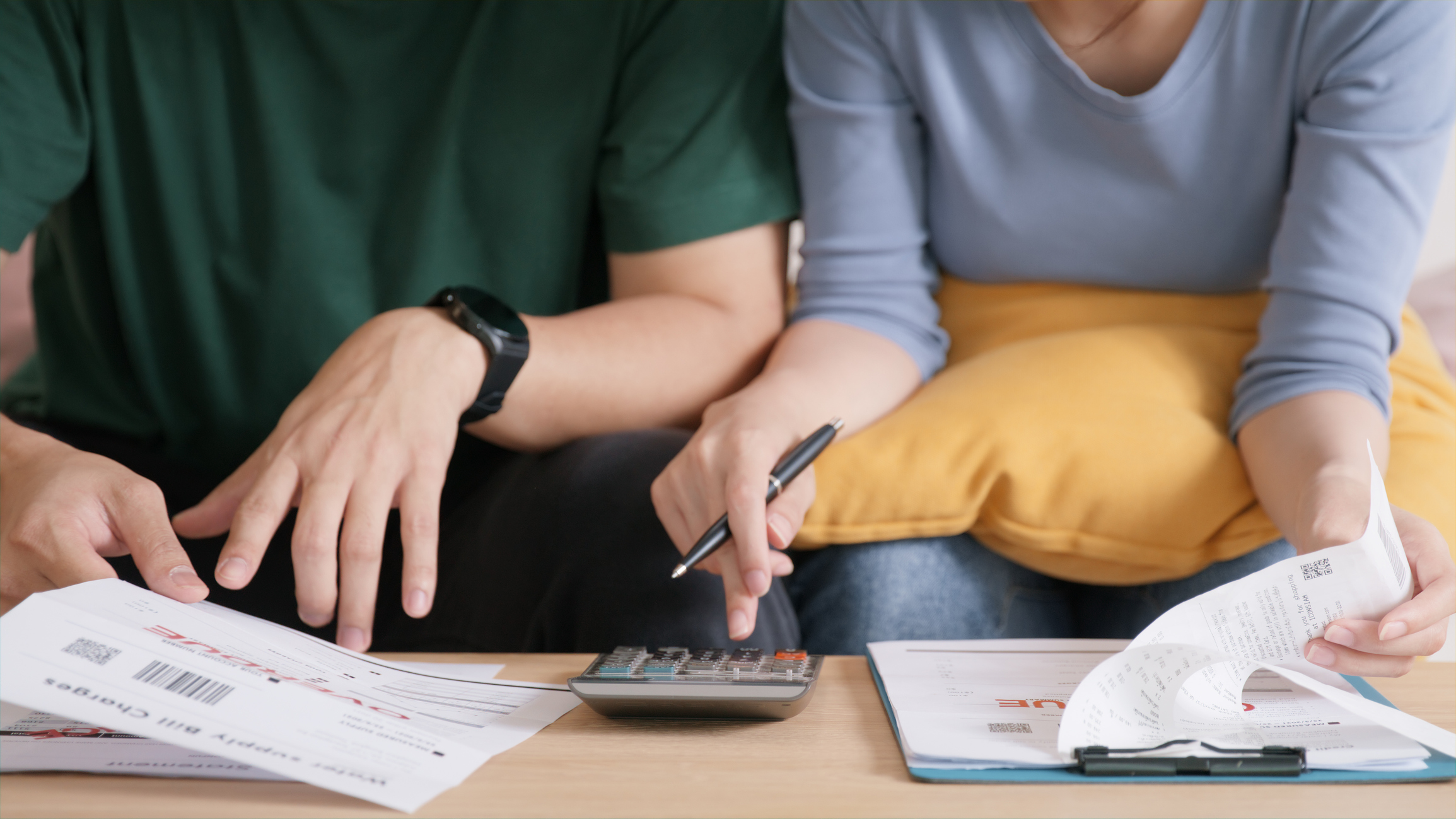 A married couple goes over their finances and expenses together.