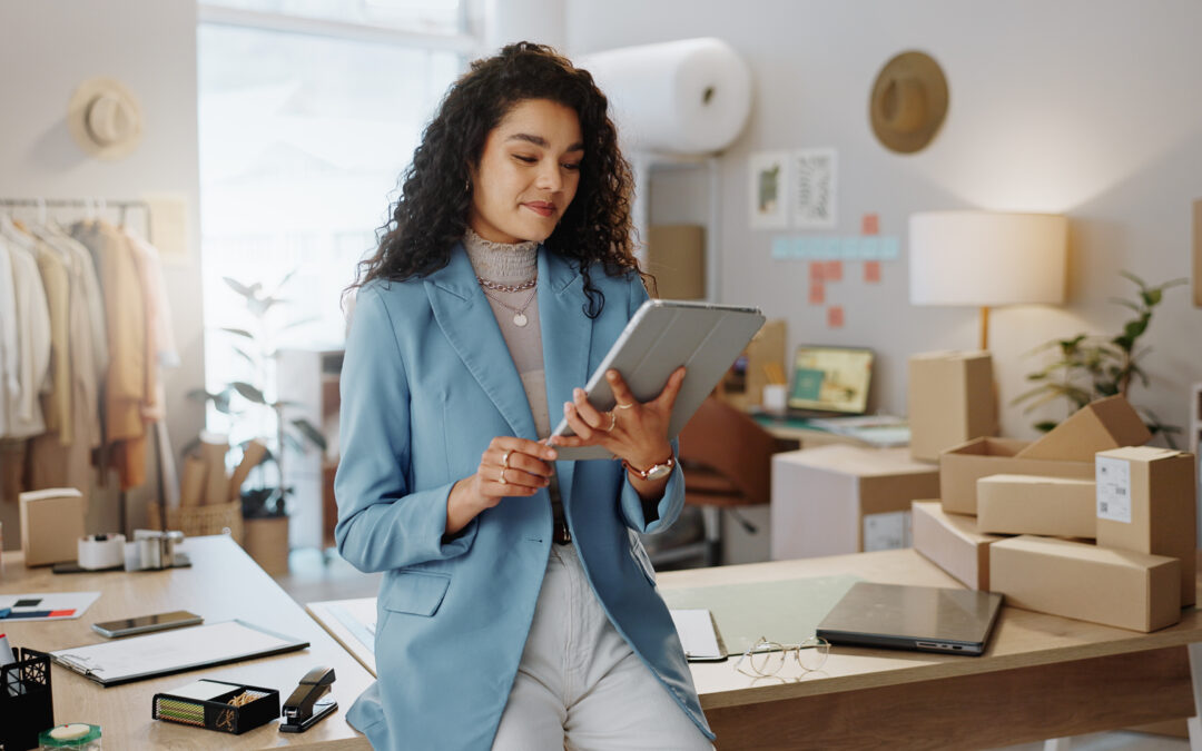 A woman manages her business finances in her home office.