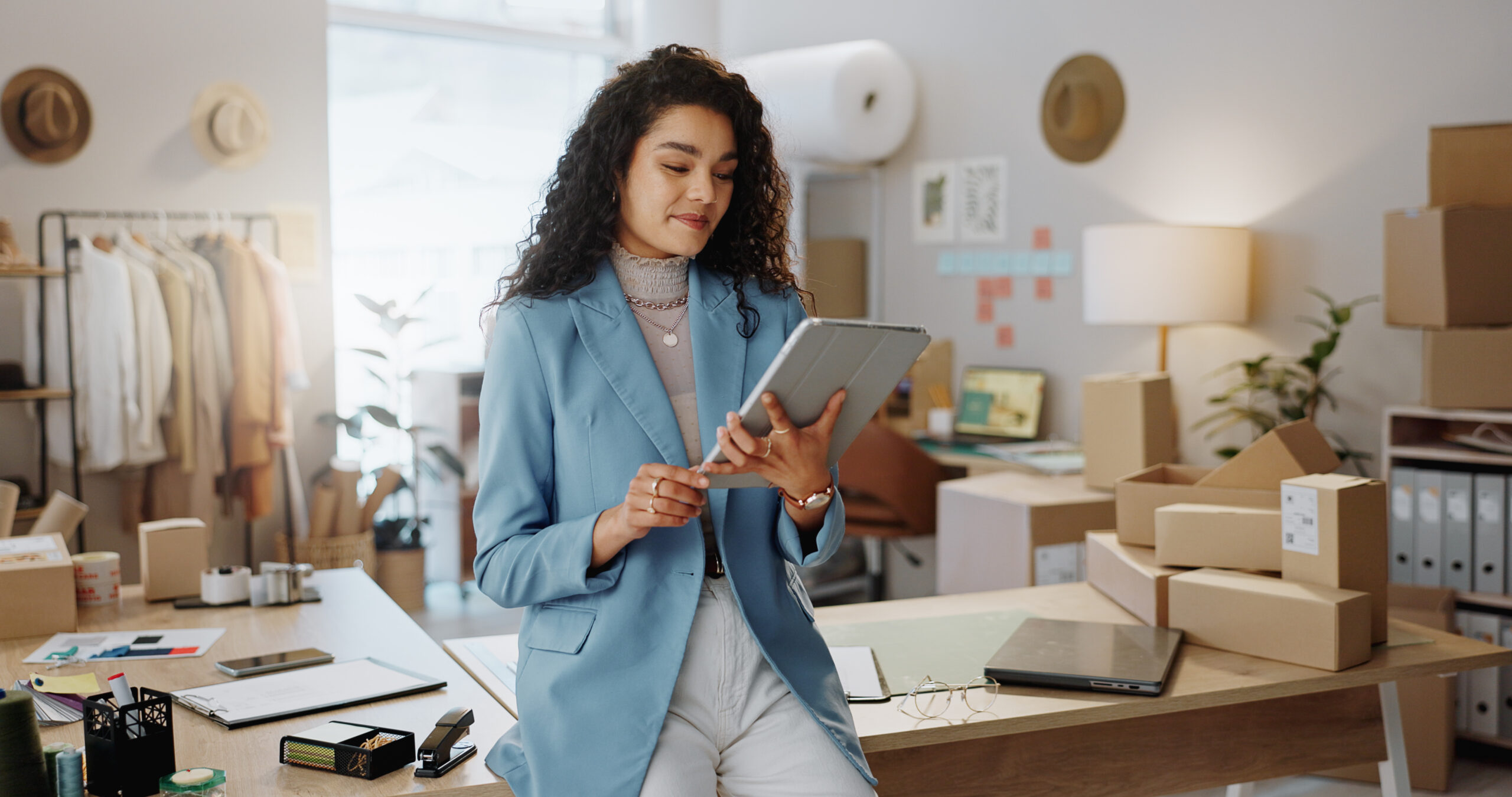 A woman manages her business finances in her home office.