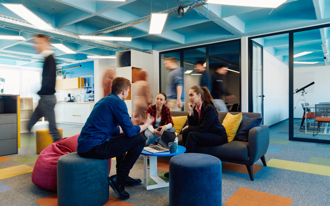 A modern office space with happy coworkers.